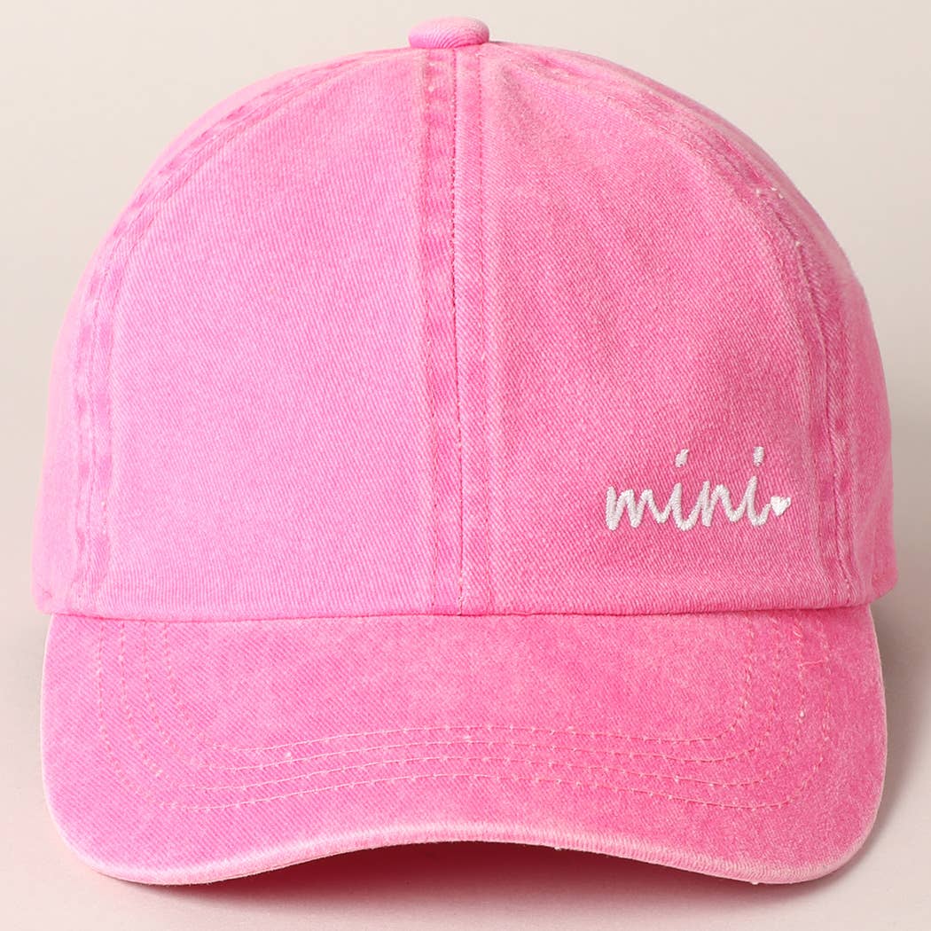Close-up of Mini embroidery on pink and green baseball cap