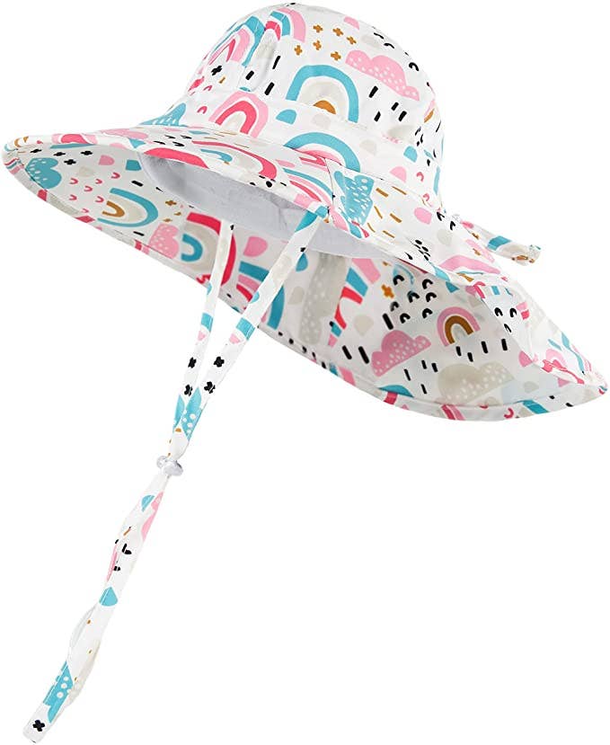 Close-up of rainbows and clouds design on infant bucket hat