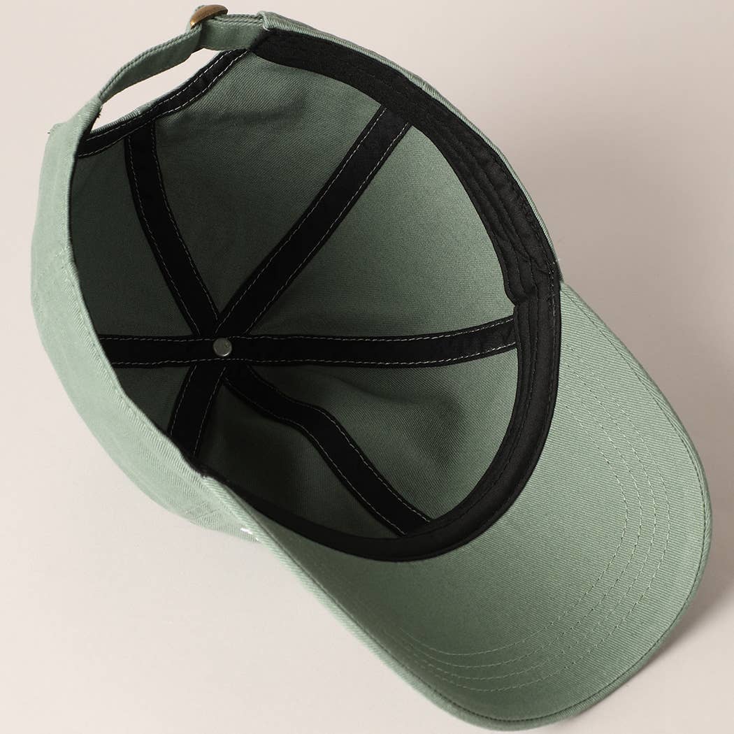 inside view of Mama & Mini embroidered baseball caps in green