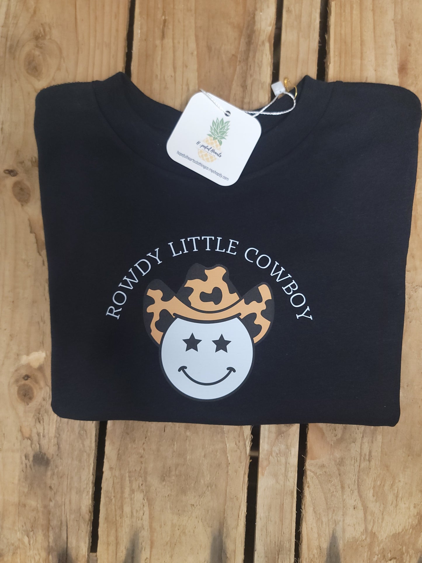 Folded Rowdy Cowboy Tee for infants and toddlers, soft cotton western-style shirt with cowboy graphic