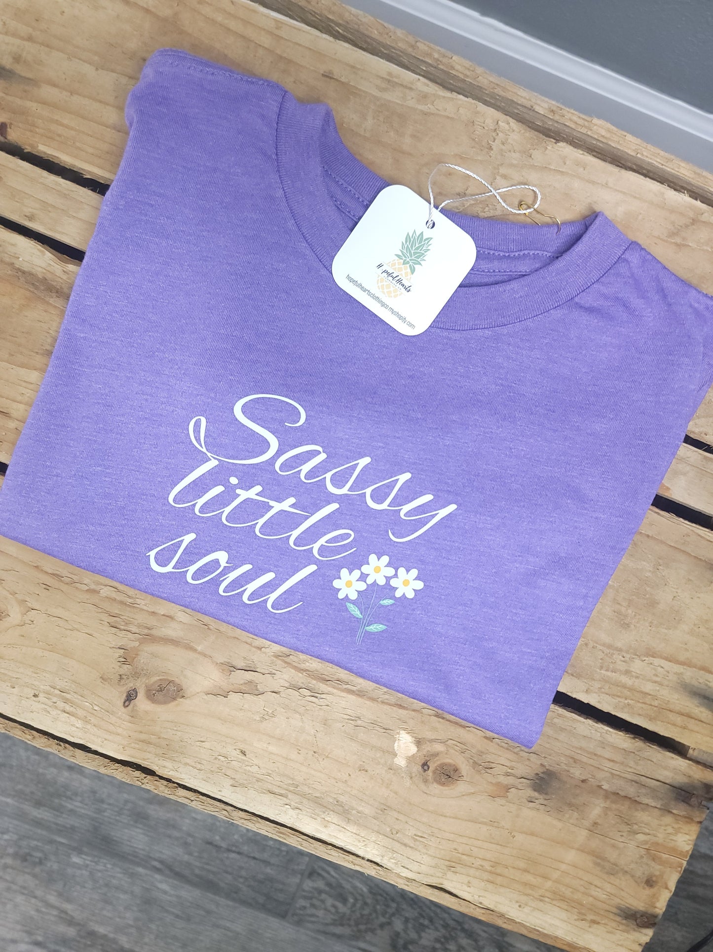 Folded purple Sassy Little Soul Tee, soft and durable cotton blend toddler shirt with playful graphic design