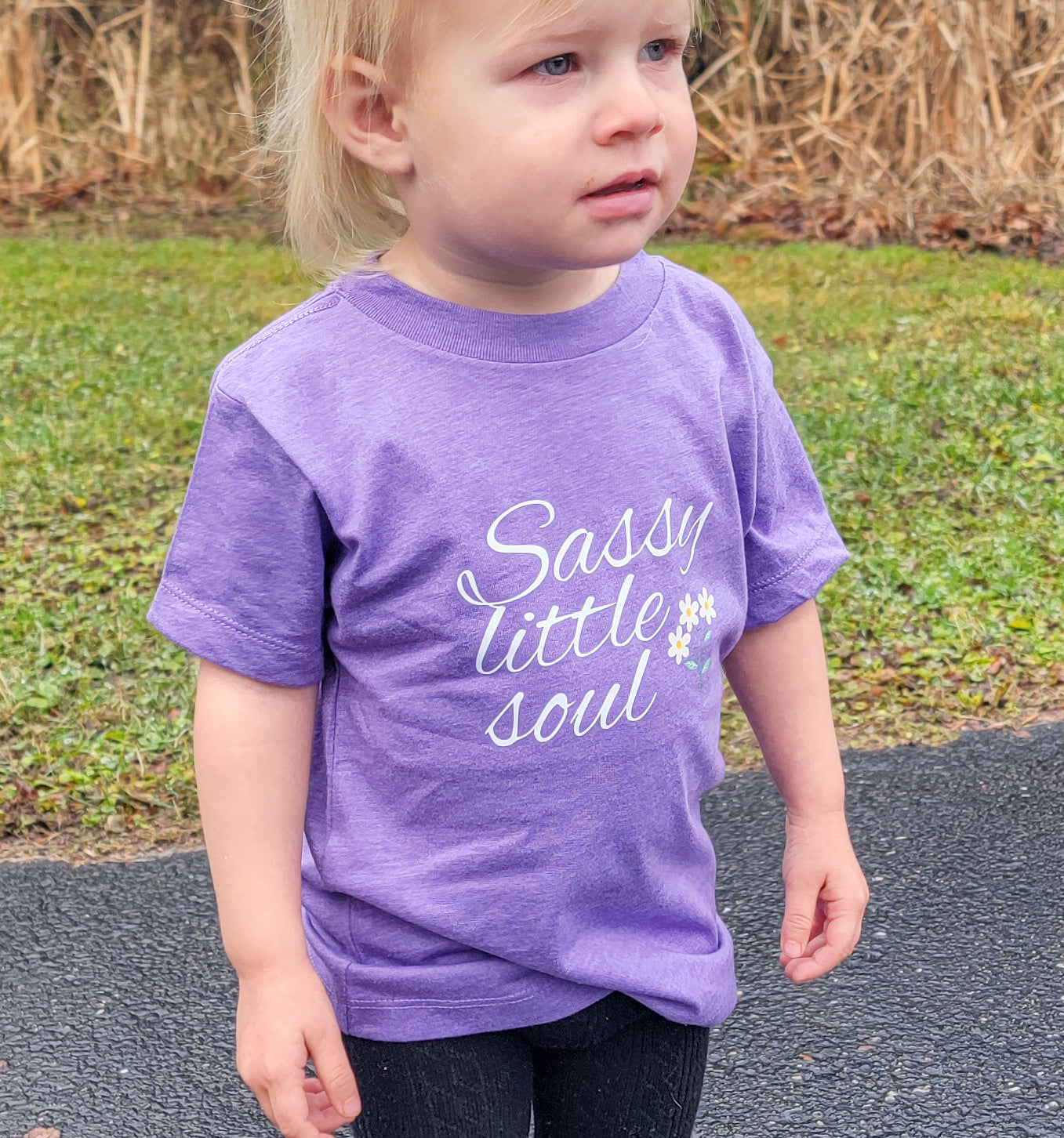 Toddler modeling purple Sassy Little Soul Tee, a stylish and comfortable graphic shirt for playful everyday wear