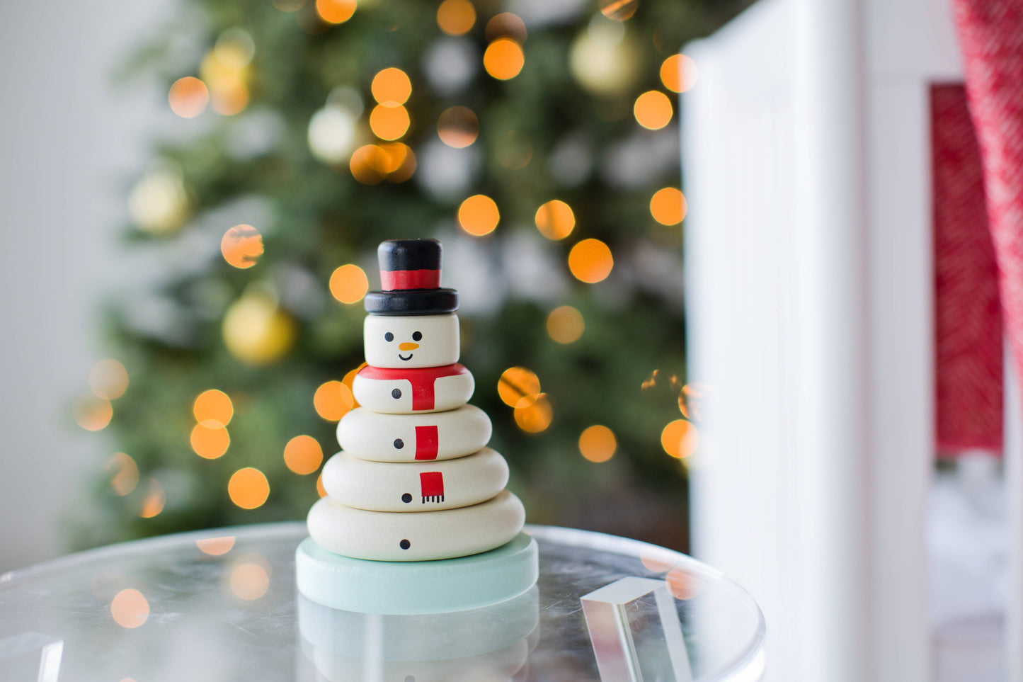 Wooden Snowman Stacking Holiday Toy displayed in Christmas background, festive décor and playtime toy