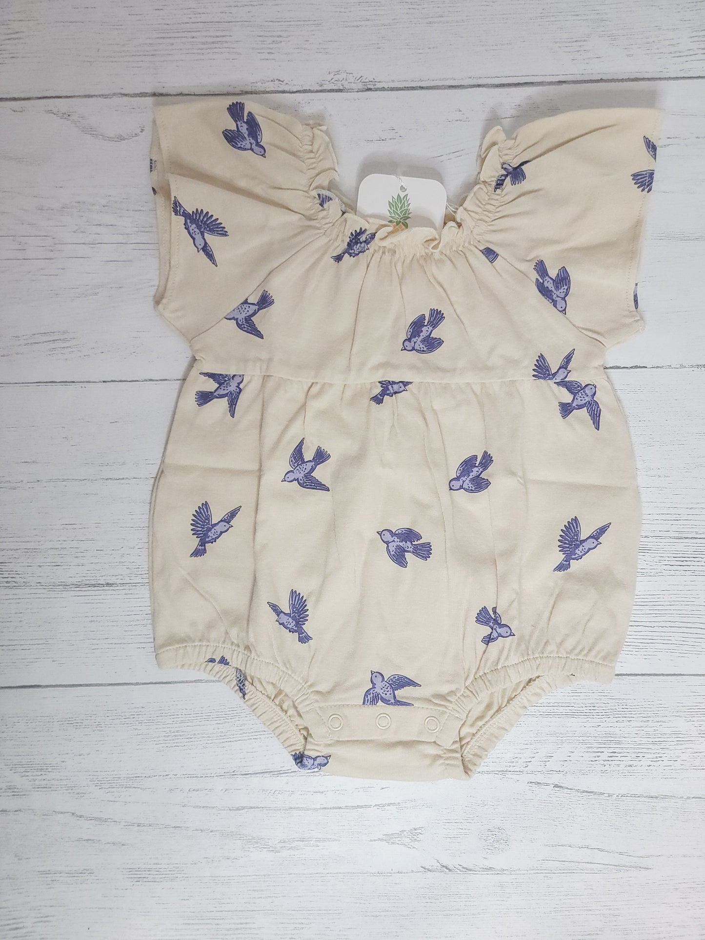 Flat lay of Bluebird Flutter Sleeve Romper for toddler & infant girls, showing design, color, and cotton fabri
