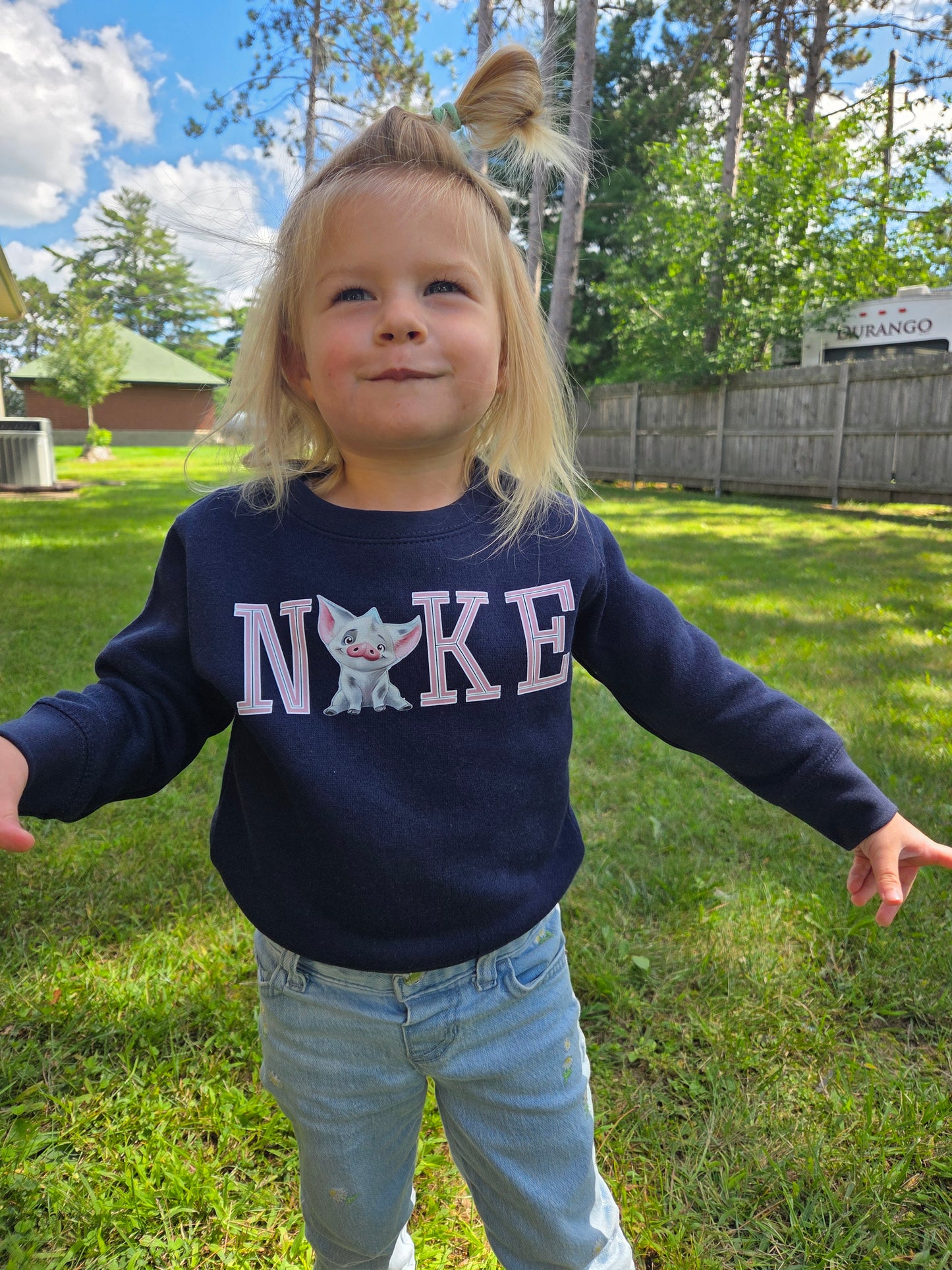 Front view of toddler wearing Pua Crewneck inspired by Moana’s sidekick, showing design and fit