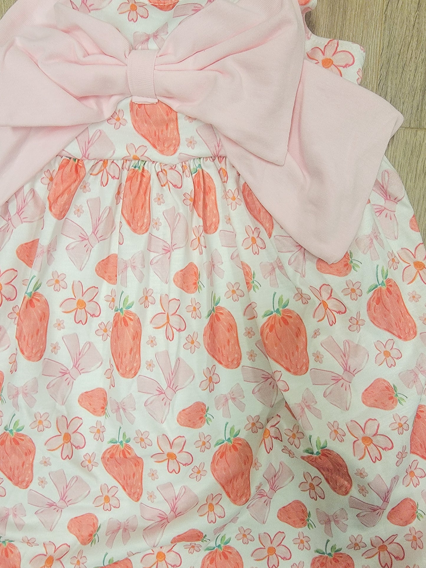 Toddler and youth strawberry-themed summer dress, playful pink bow accent, perfect for warm-weather occasions