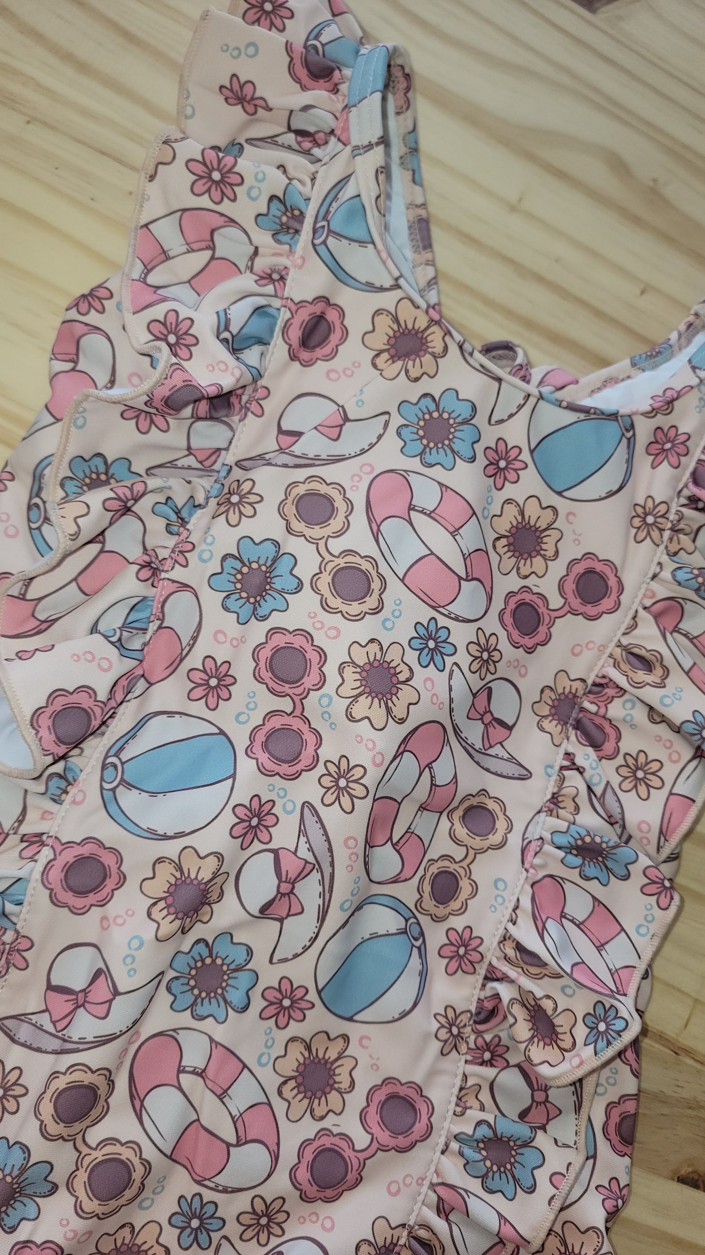 Soft and durable pink one-piece swimsuit, Beach Fun design with sunglasses and beach ball print, UPF 50+