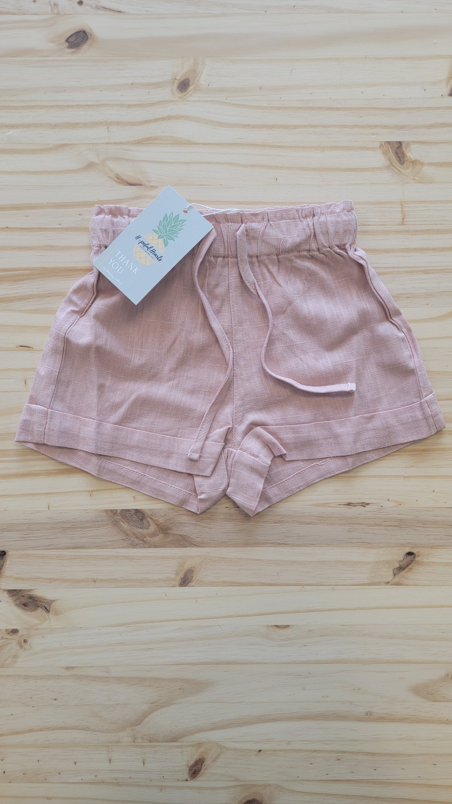 Peach linen shorts for girls – breathable kids clothing for playtime