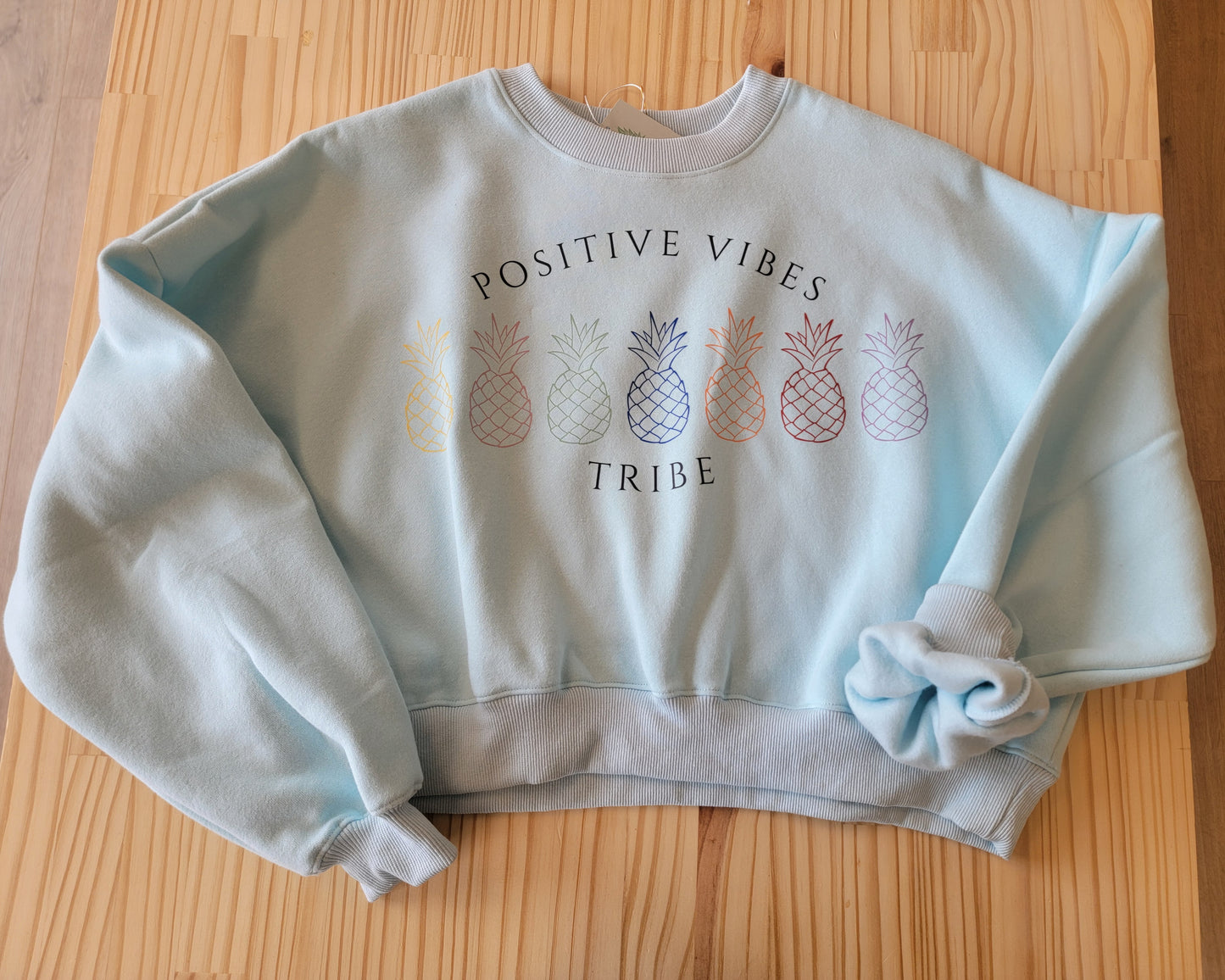 Cozy oversized crop sweatshirt for women, infertility awareness hoodie with Positive Vibes Tribe graphic front view
