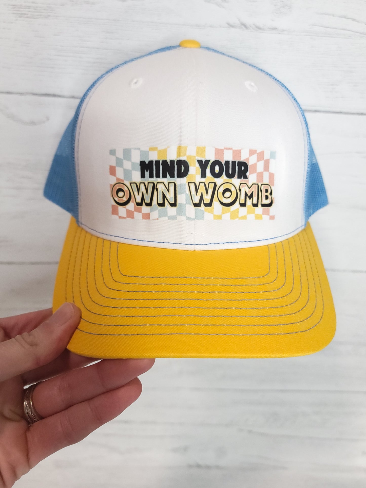Mind Your Own Womb Trucker Hat