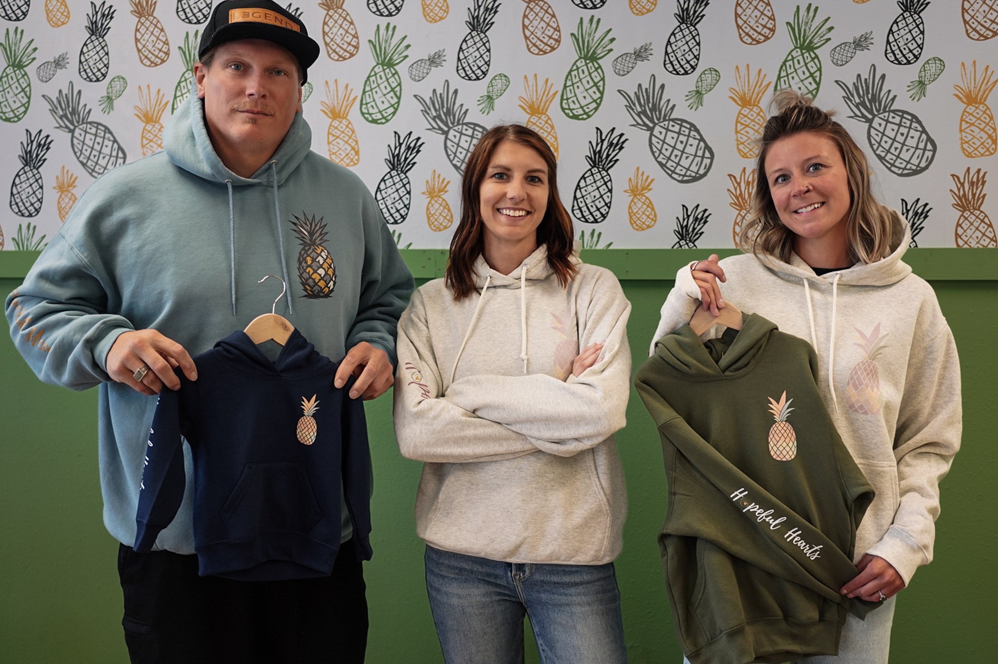 Infertility awareness hoodie in beige, soft unisex sweatshirt with Hopeful Hearts pineapple design