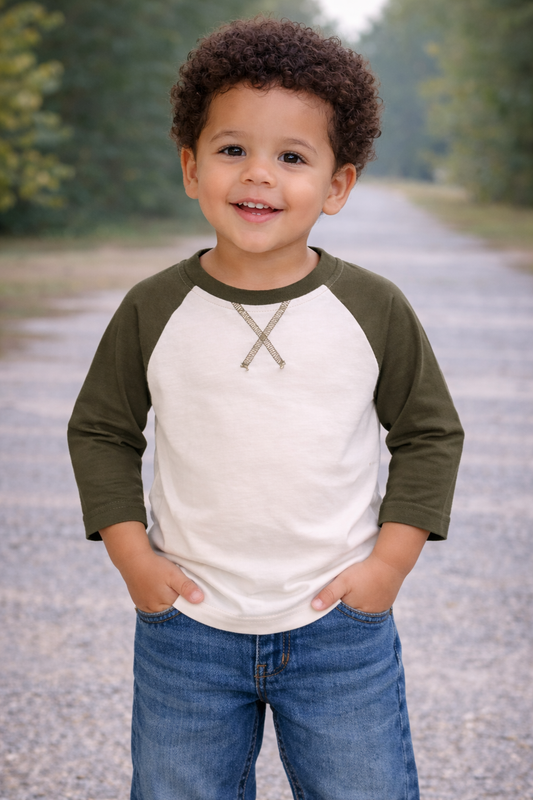 Toddler boy age 2 wearing a cream and olive 3/4 sleeve raglan shirt